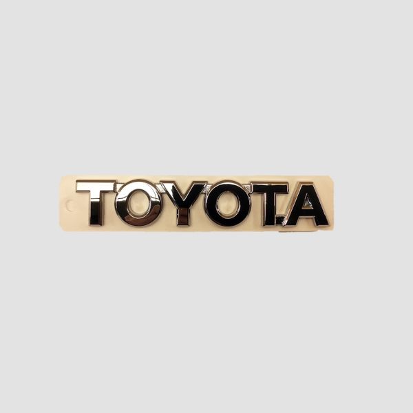 TOY 75446-0H010 Schriftzug Toyota Heckstossfänger
